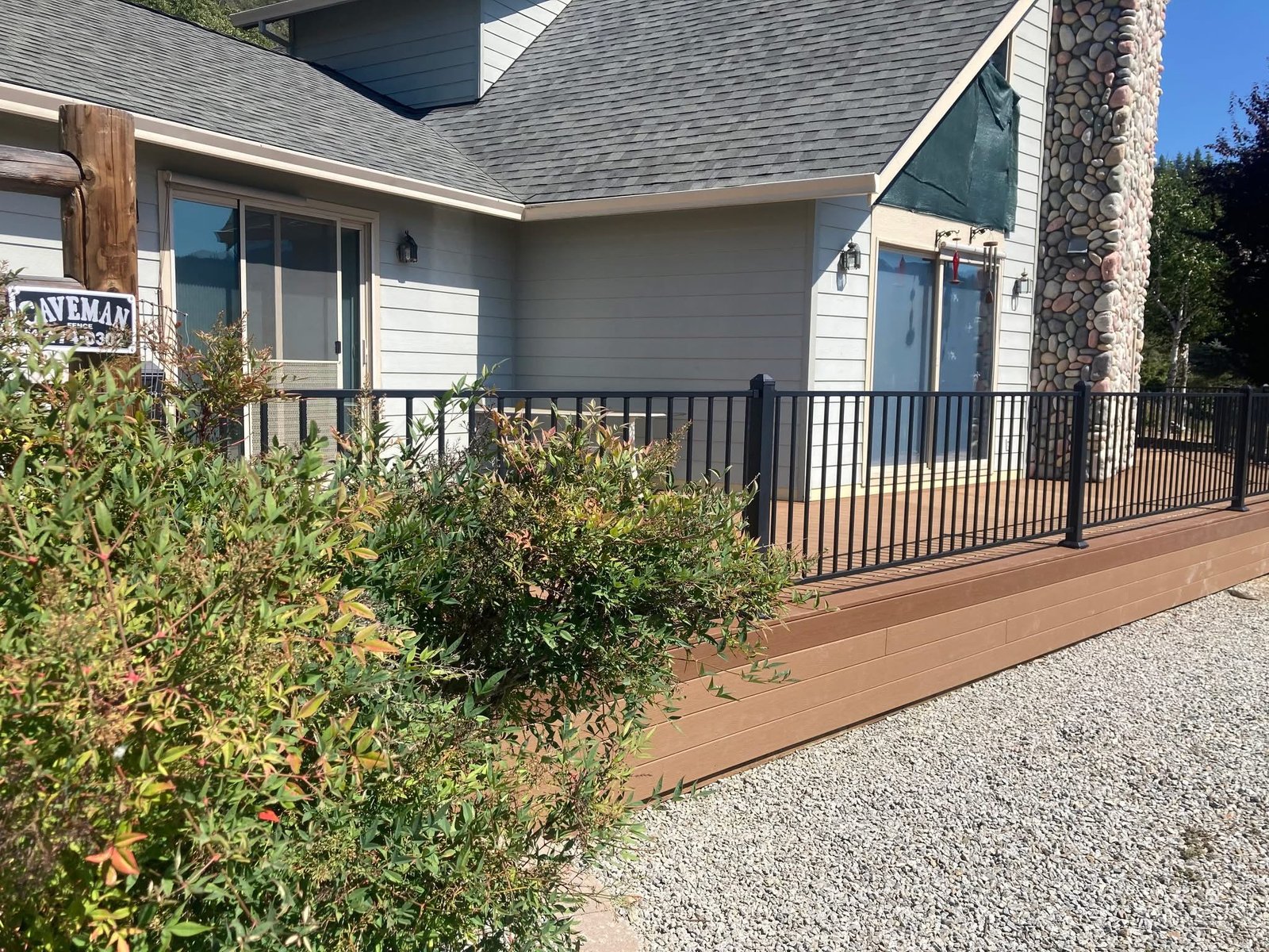 Composite deck with black metal railings